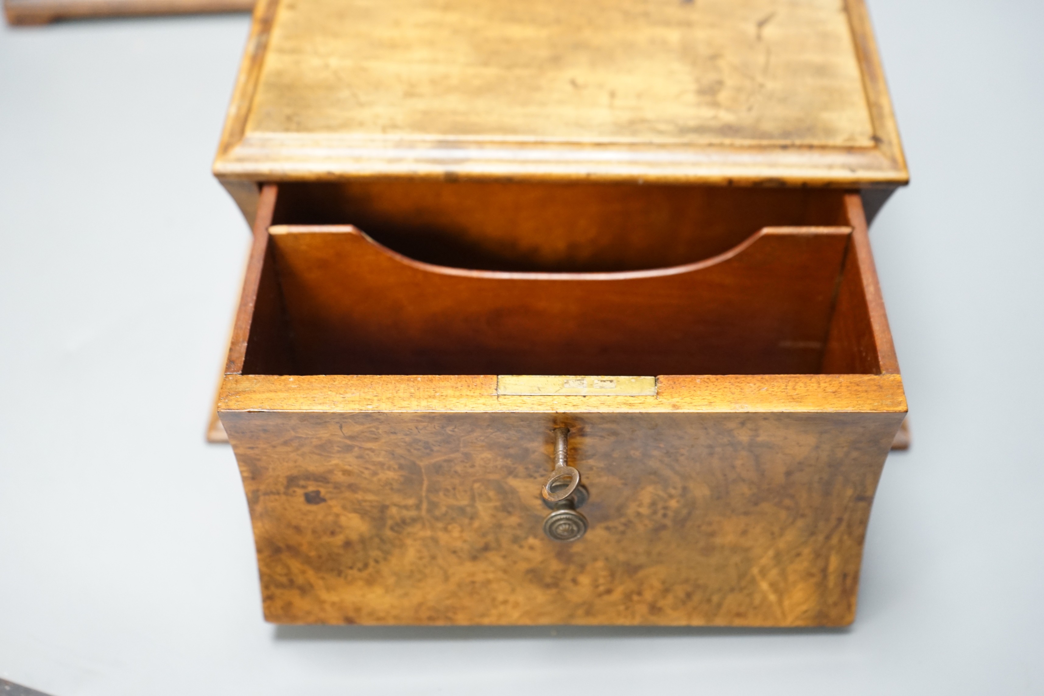 A George III mahogany tea caddy with inlaid decoration, together with a burr walnut veneer cavetto stationery box, both with keys